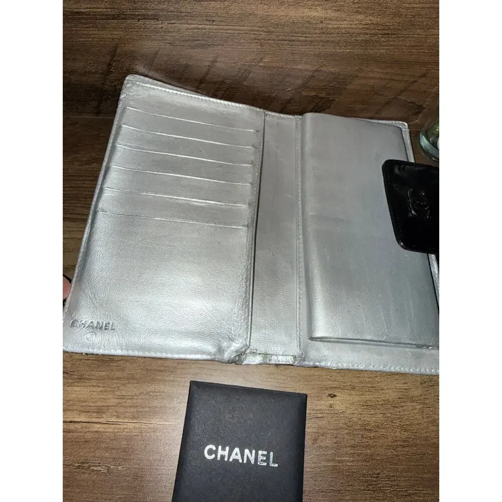 Chanel Icon Symbols Bifold Wallet Black Embossed Metallic Silver Kiss Lock